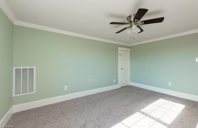 carpeted empty room with ceiling fan and ornamental molding