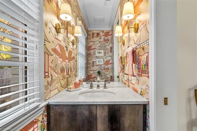 bathroom with vanity and crown molding