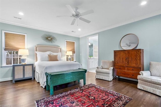 bedroom featuring ensuite bath, ornamental molding, ceiling fan, multiple windows, and dark hardwood / wood-style floors