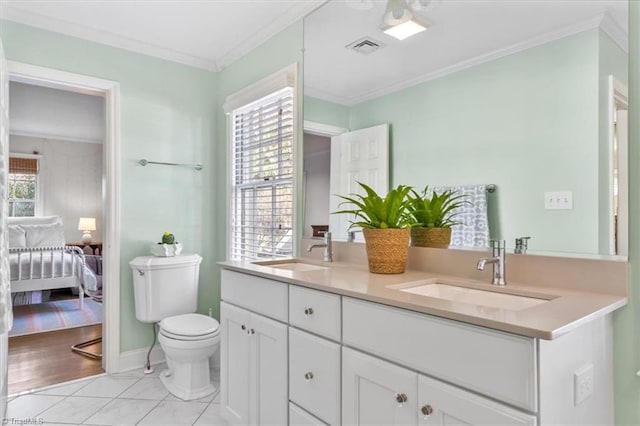 bathroom featuring tile patterned floors, plenty of natural light, toilet, and vanity