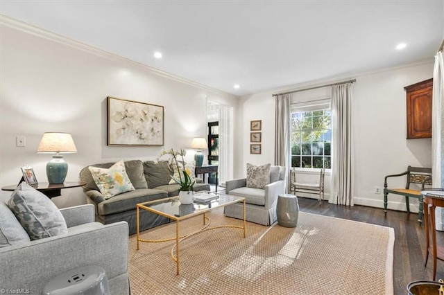 living room with dark hardwood / wood-style flooring and crown molding