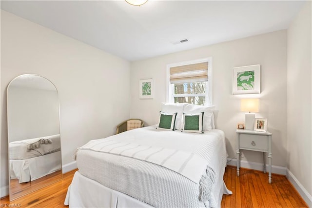 bedroom with light hardwood / wood-style floors