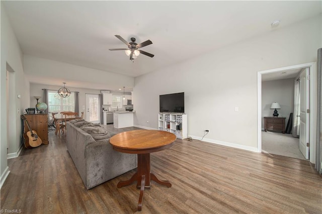 living room featuring ceiling fan and hardwood / wood-style floors