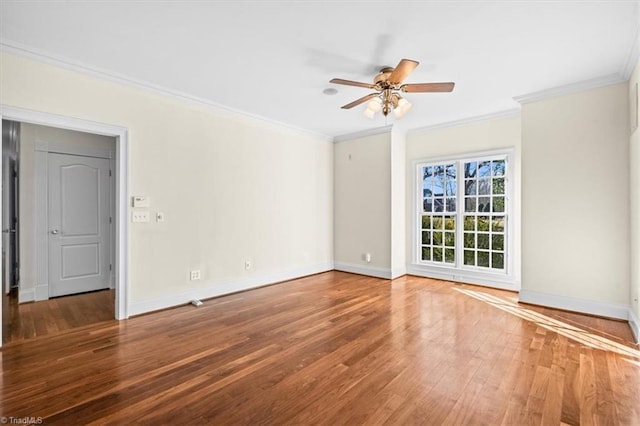 spare room featuring ceiling fan, ornamental molding, and hardwood / wood-style floors