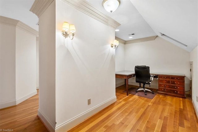 office with vaulted ceiling, ornamental molding, and light hardwood / wood-style floors