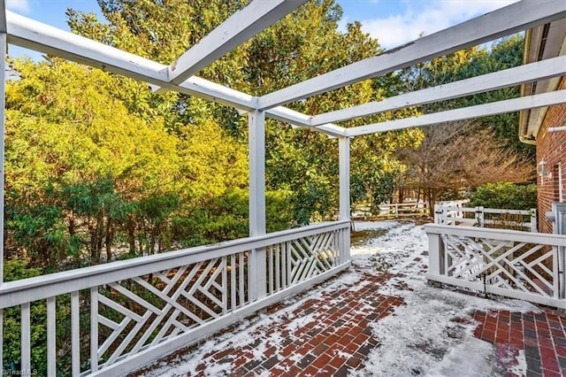 wooden terrace featuring a patio