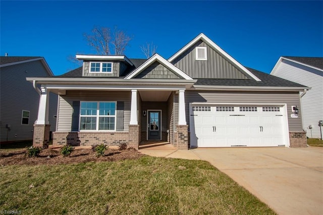 craftsman-style house with a porch, a front yard, and a garage