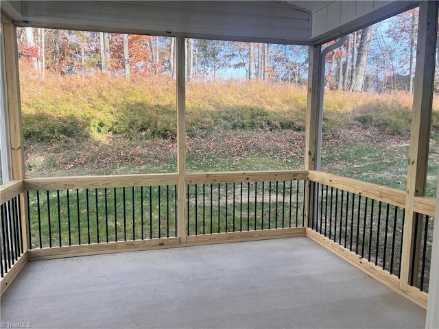 unfurnished sunroom featuring plenty of natural light