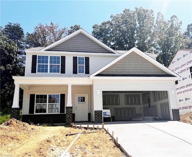 craftsman-style house with a garage and covered porch