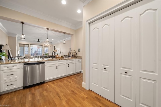 kitchen with light wood finished floors, crown molding, light stone countertops, dishwasher, and hanging light fixtures