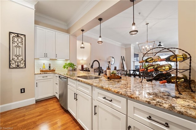 kitchen with crown molding, dishwasher, light wood-style flooring, white cabinetry, and a sink