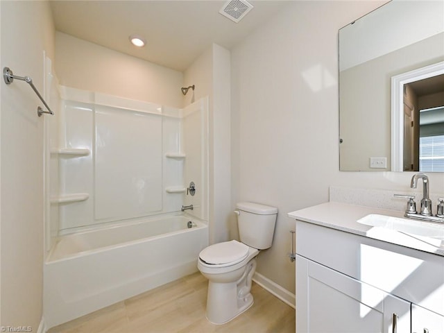 full bathroom with vanity, toilet, hardwood / wood-style floors, and  shower combination