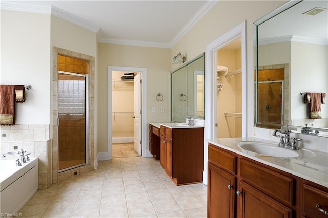 bathroom featuring vanity, tile patterned floors, ornamental molding, and separate shower and tub