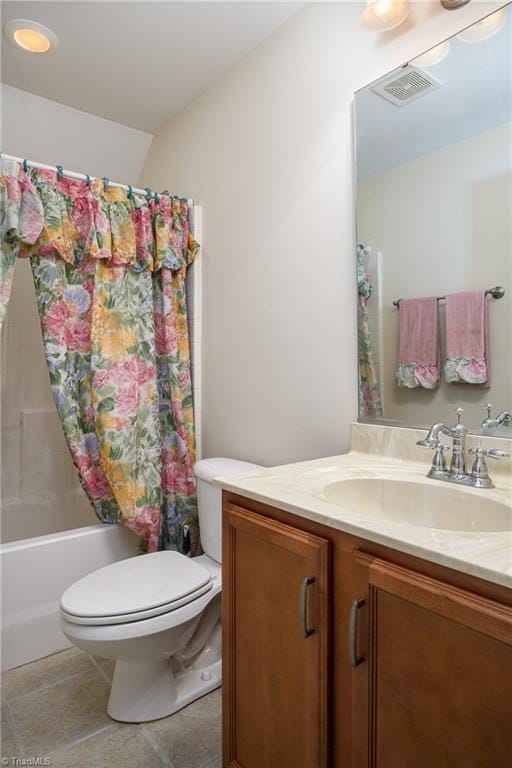 full bathroom featuring vanity, tile patterned floors, toilet, and shower / tub combo with curtain