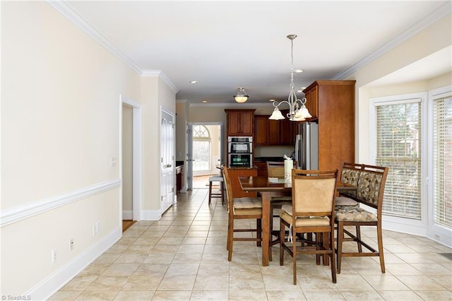 dining space with crown molding, a chandelier, and light tile patterned floors