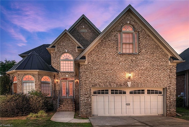 view of front of home with a garage