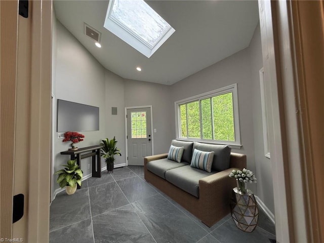 living room featuring baseboards, a skylight, high vaulted ceiling, and recessed lighting