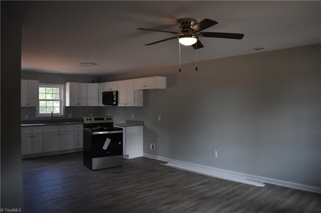 kitchen featuring dark hardwood / wood-style flooring, ceiling fan, white cabinetry, and stainless steel range with electric stovetop