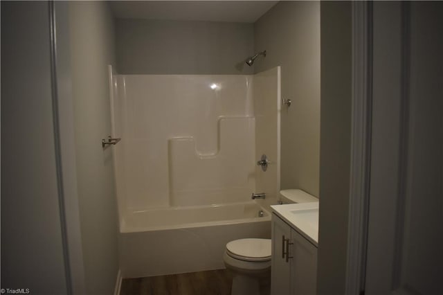 bathroom featuring shower / tub combination, wood finished floors, toilet, and vanity