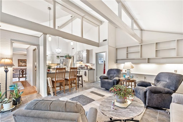 living room featuring high vaulted ceiling