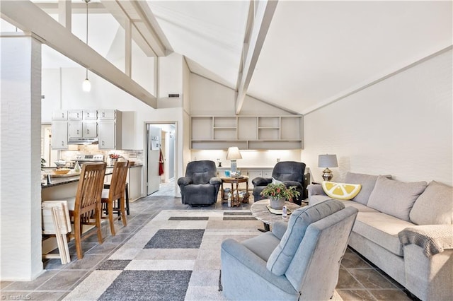 living room featuring beam ceiling and high vaulted ceiling