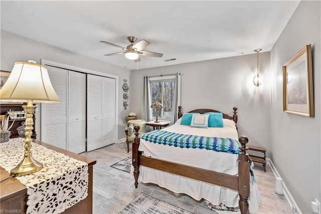 bedroom featuring ceiling fan and a closet