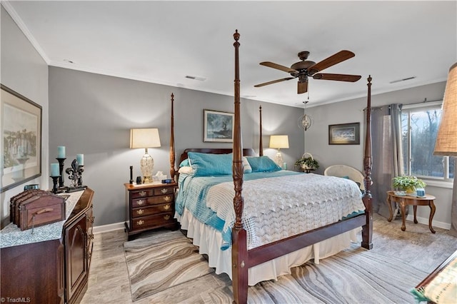 bedroom with ceiling fan and ornamental molding