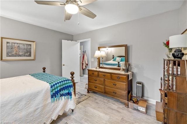 bedroom featuring ceiling fan and light wood-type flooring