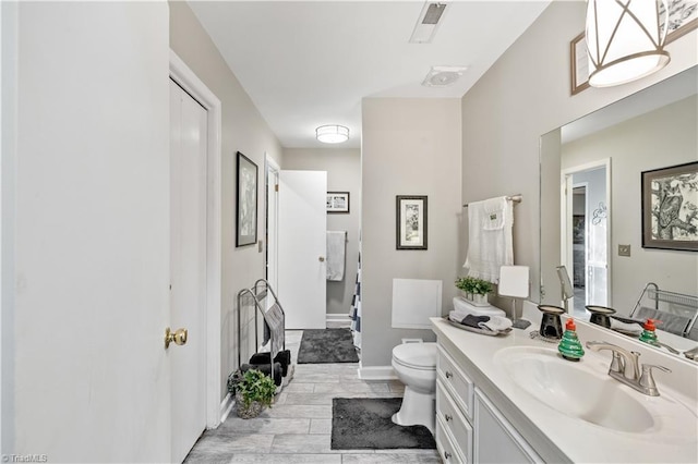 bathroom with vanity and toilet