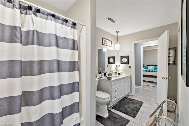 bathroom featuring vanity and wood-type flooring