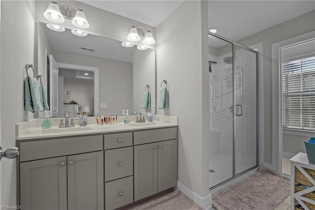 bathroom with vanity and an enclosed shower