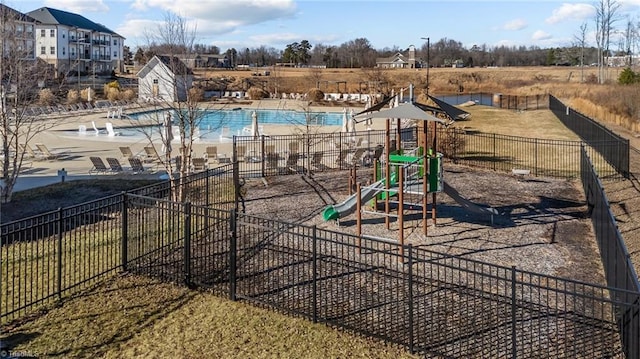 view of playground with a community pool