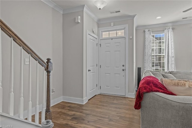 foyer featuring hardwood / wood-style flooring and ornamental molding