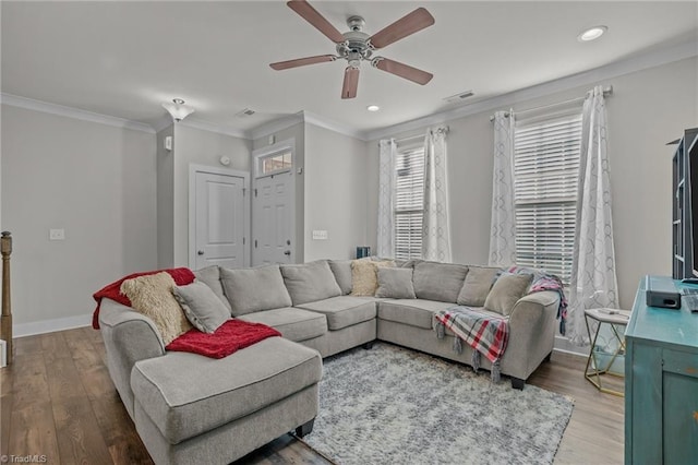 living room featuring crown molding, ceiling fan, and hardwood / wood-style floors