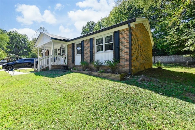 view of front of house featuring a front yard and a porch