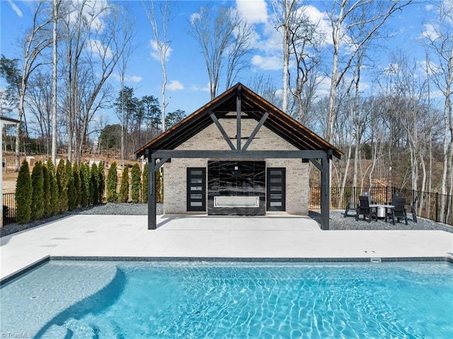 view of pool with a fenced in pool, a patio, a storage structure, fence, and an outdoor structure