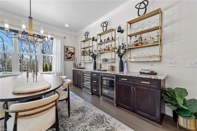 bar with ornamental molding, wine cooler, dark wood-type flooring, and bar