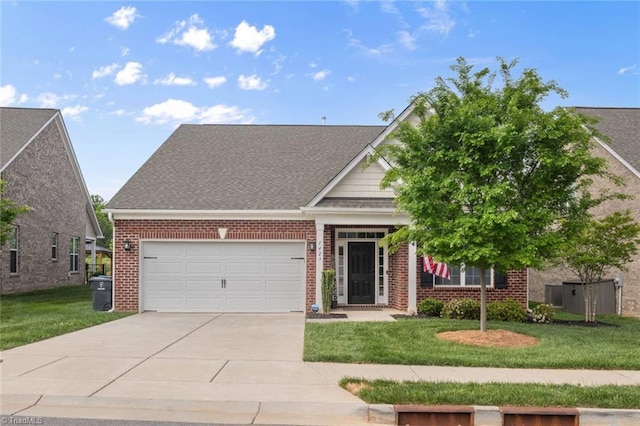 1423 Blooming Mountain Way, Kernersville, NC 27284 - view of front of house featuring concrete driveway, brick siding, a front lawn, and a garage