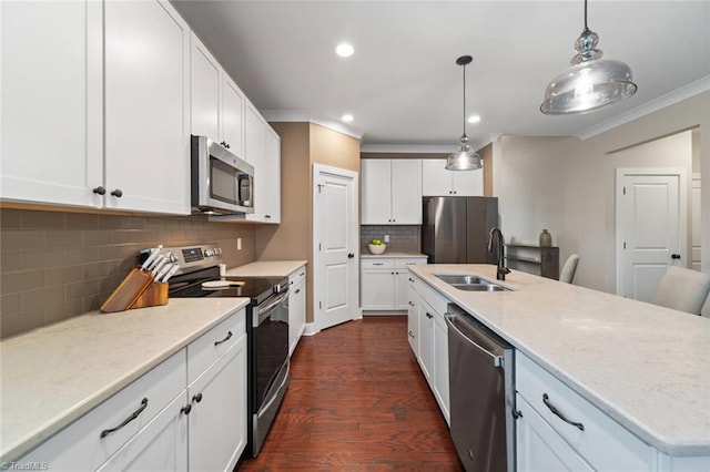 1423 Blooming Mountain Way, Kernersville, NC 27284 - kitchen with crown molding, decorative backsplash, dark wood-style flooring, a sink, and appliances with stainless steel finishes