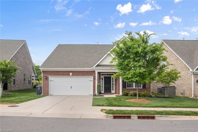 1423 Blooming Mountain Way, Kernersville, NC 27284 - view of front of house featuring a garage, a front yard, driveway, and brick siding