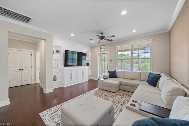 1423 Blooming Mountain Way, Kernersville, NC 27284 - living area featuring baseboards, ornamental molding, wood finished floors, and visible vents