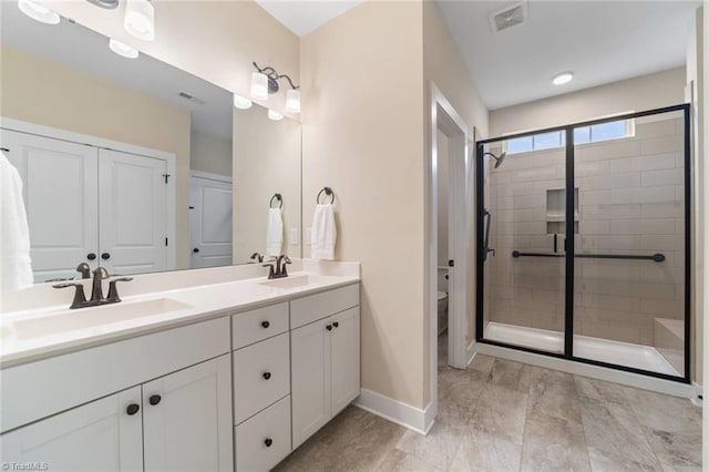 1423 Blooming Mountain Way, Kernersville, NC 27284 - bathroom featuring a sink, toilet, baseboards, a shower stall, and visible vents