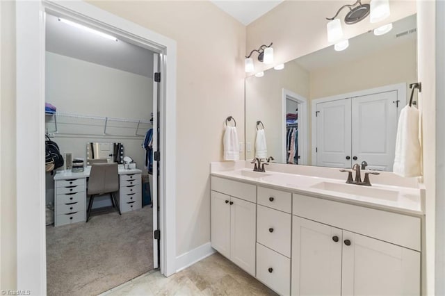 1423 Blooming Mountain Way, Kernersville, NC 27284 - bathroom with double vanity, a sink, visible vents, and a spacious closet