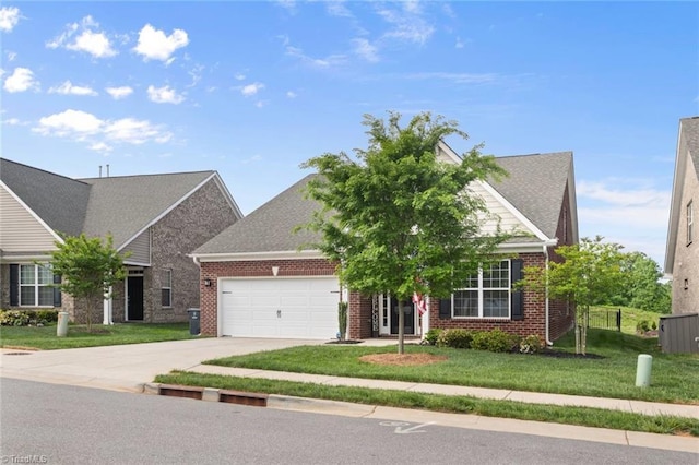 1423 Blooming Mountain Way, Kernersville, NC 27284 - view of front of property with brick siding, driveway, a front yard, and a garage