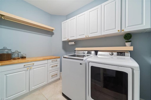 1423 Blooming Mountain Way, Kernersville, NC 27284 - washroom with cabinet space, light tile patterned floors, and washing machine and dryer