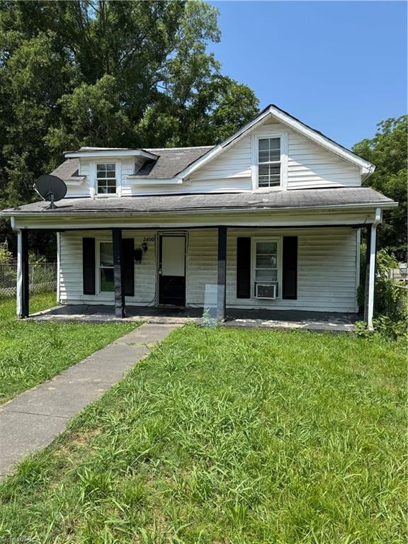2400 Peachtree St, Winston-Salem, NC 27107 - view of front of home with a porch, a front yard, and a shingled roof