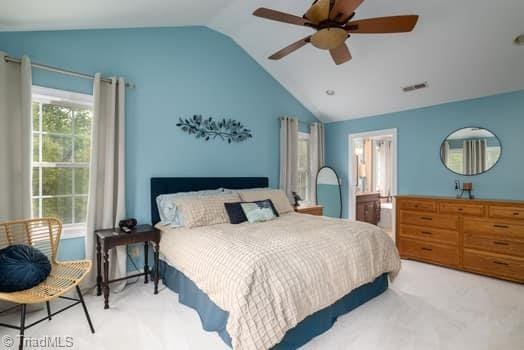 carpeted bedroom with lofted ceiling and ceiling fan