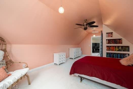 bedroom with lofted ceiling, carpet floors, and ceiling fan