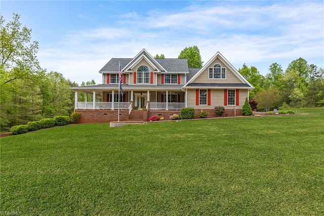 view of front facade with a front yard and a porch