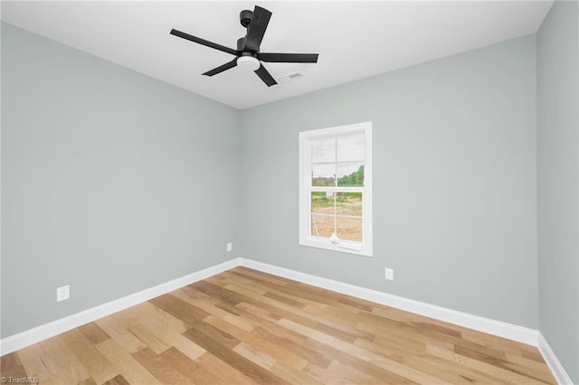 unfurnished room with light wood-type flooring, baseboards, and a ceiling fan